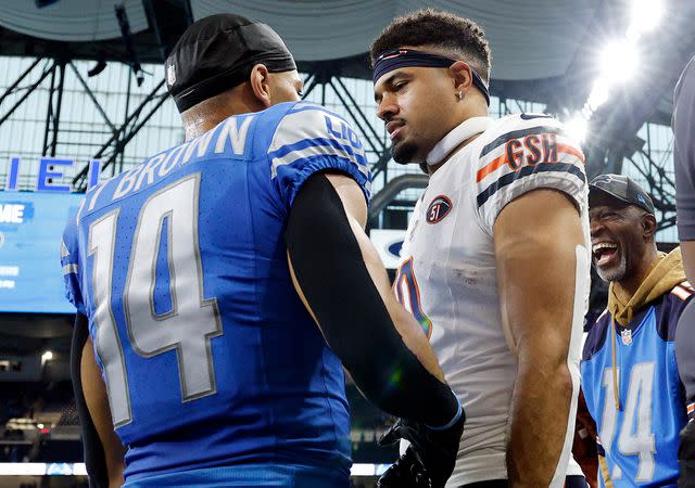 <p>Mike Mulholland/Getty</p> Amon-Ra St. Brown and Equanimeous St. Brown after a game at Ford Field on November 19, 2023 in Detroit, Michigan.