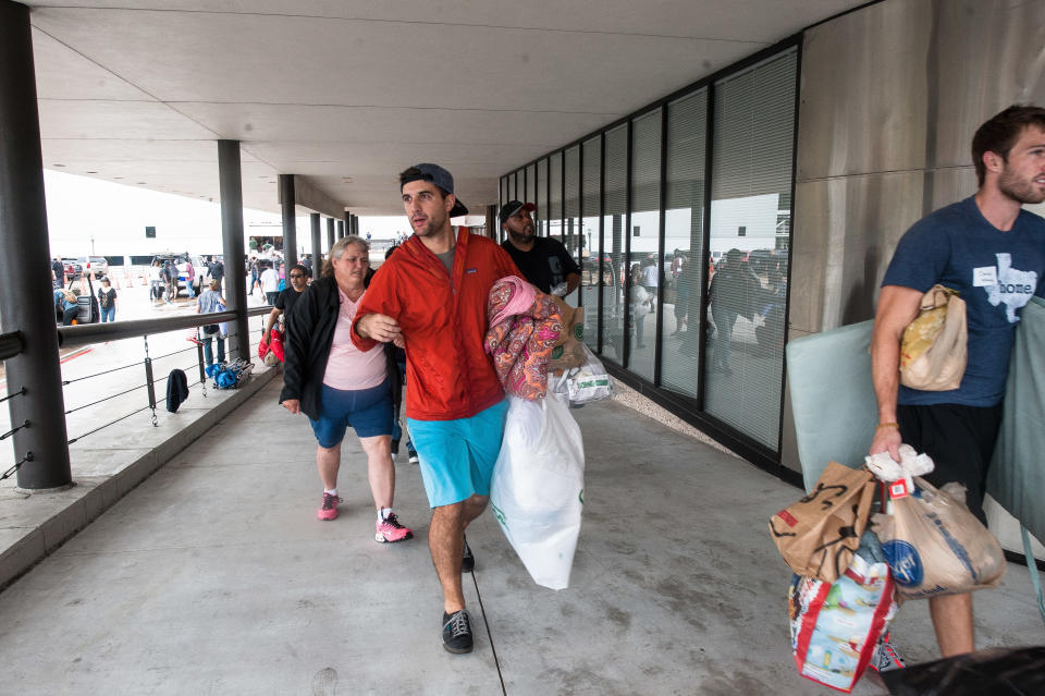 People bring donations to Lakewood Church. (Photo: Joseph Rushmore for HuffPost)