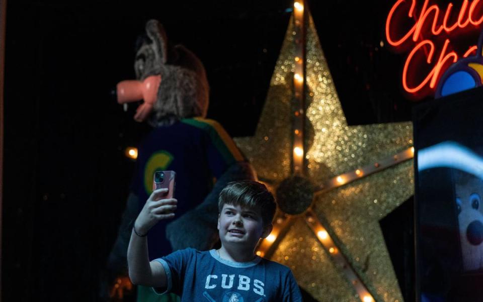 Dominic Zepsa, 12, takes a selfie with Munch’s Make Believe Band at Chuck E. Cheese in Charlotte, N.C., on Friday, May 31, 2024. This Chuck E. Cheese is one of the five being saved in the U.S.