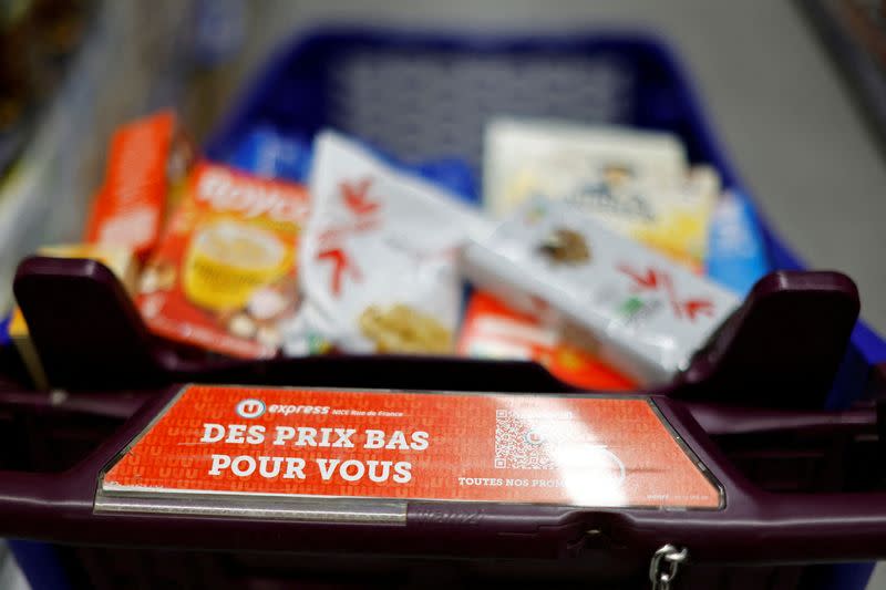 FILE PHOTO: Customers shop in a supermarket in Nice