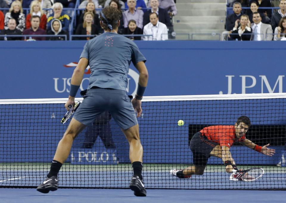 Djokovic of Serbia hits a return to Nadal of Spain during their men's final match at the U.S. Open tennis championships in New York