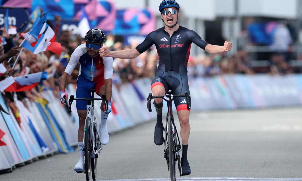 <span>Fin Graham celebrates as he crosses the finish line to win gold in the men's C1-3 road race.</span><span>Photograph: Michael Steele/Getty Images</span>