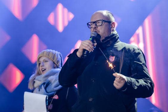 On stage in Gdansk shortly before the attack on 13 January (Reuters)