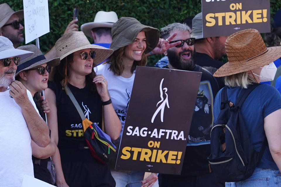 LOS ANGELES, CA - JULY 18:  Katie Lowes and Mandy Moore walk the picket line in support of the SAG-AFTRA and WGA strike on July 18, 2023 in Los Angeles, California.  (Photo by Hollywood To You/Star Max/GC Images)