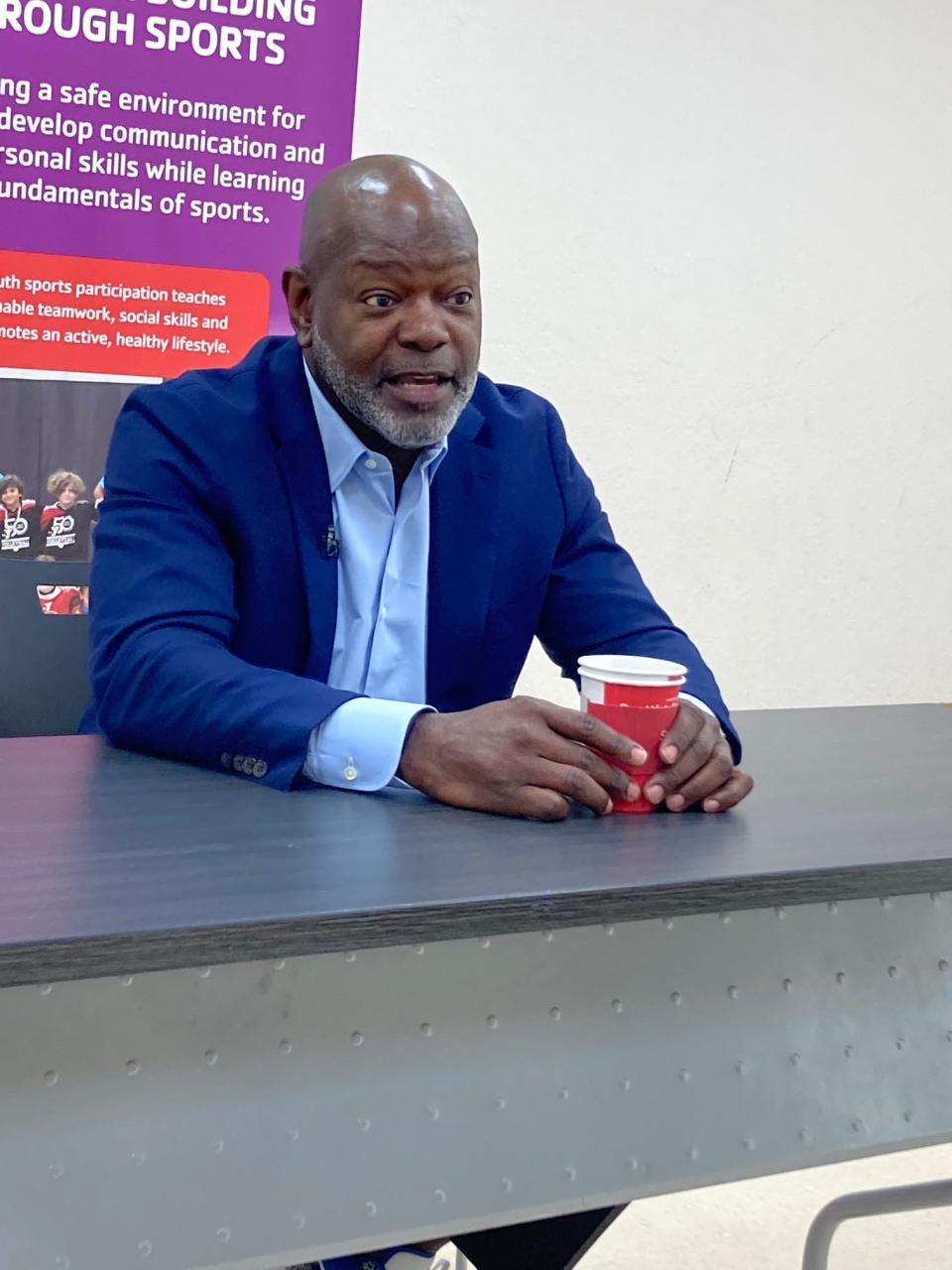 Emmitt Smith talks to reporters Wednesday before his motivational speech at the Peter Blum Family YMCA fundraising event in Boca Raton,