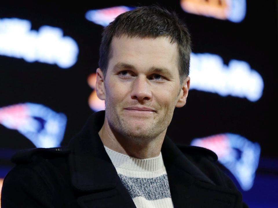 Tom Brady smiles during a press conference in 2016.