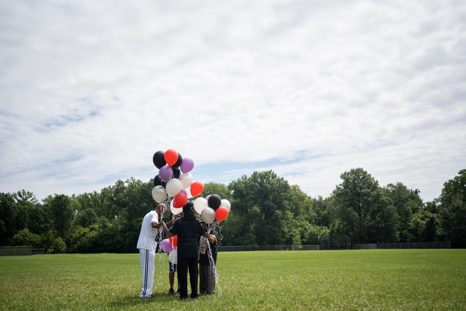 Jul 31, 2022; Columbus, Ohio, United States;  Lamont Turner died by suicide after being sexually abused by his doctor. His family releases balloons outside the school he previously worked at, Walnut Ridge, at 1 p.m., July 31, which is the anniversary of his death. 