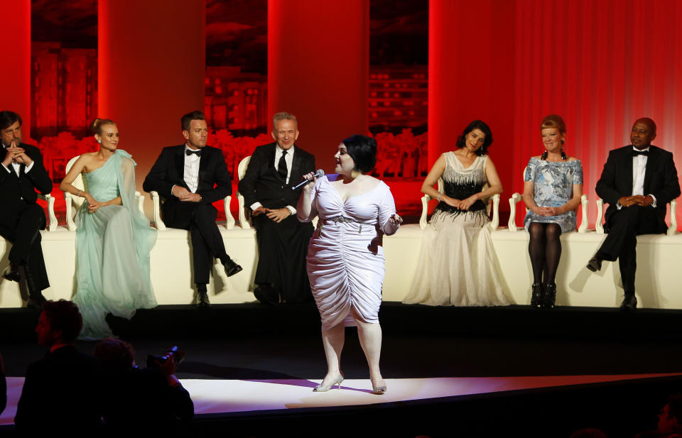 Singer Beth Ditto, at front, performs as members of the jury from left, Nanni Moretti, Diane Kruger, Ewan McGregor, Jean-Paul Gaultier, Hiam Abbass, Andrea Arnold, and Raoul Peck at the opening ceremony at the 65th international film festival, in Cannes, southern France, Wednesday, May 16, 2012. (AP Photo/Francois Mori)