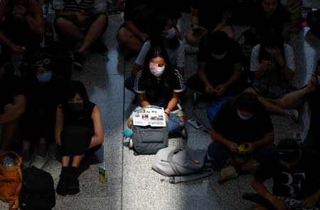 Anti-extradition bill demonstrators attend a protest at the departure hall of Hong Kong Airport