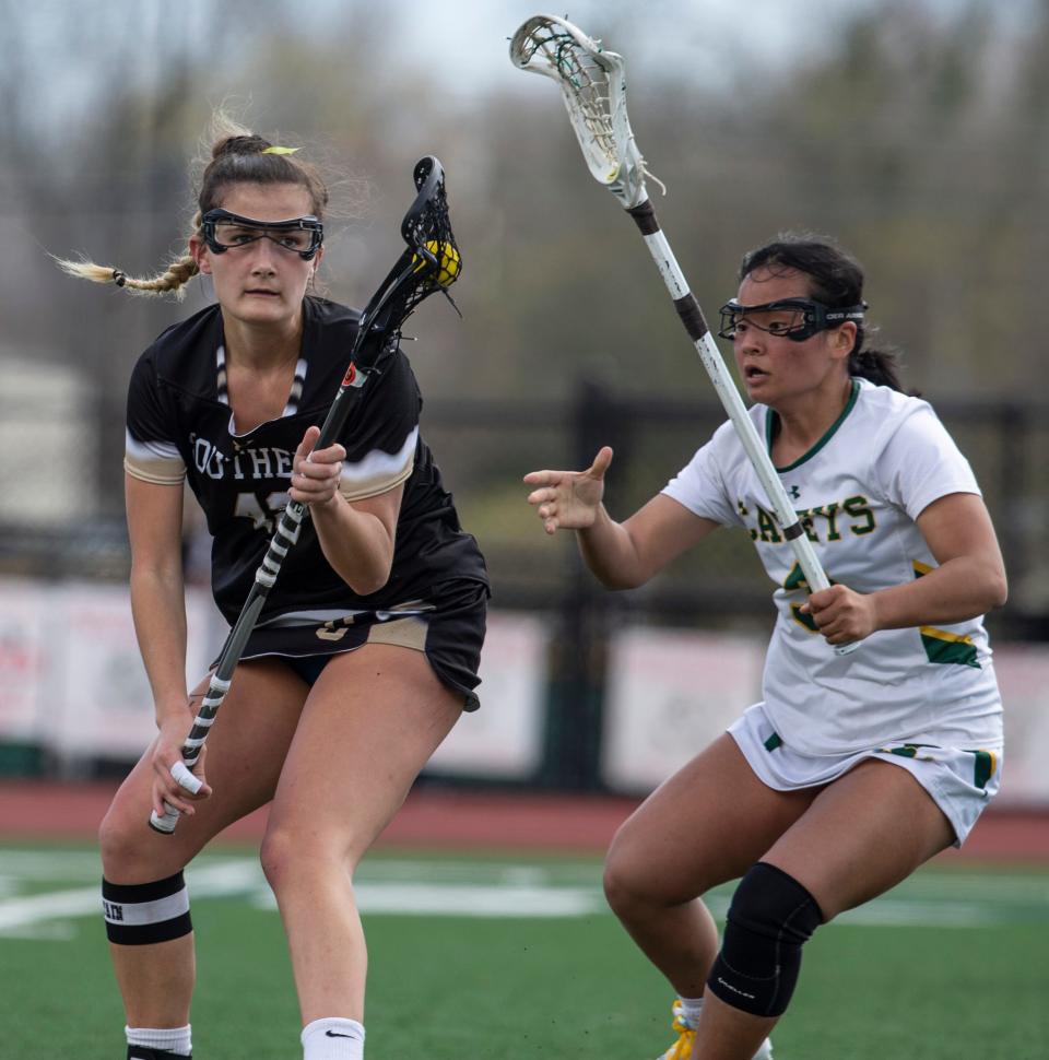 Southern Regional vs Red Bank Catholic girls lacrosse. Southernâ€™s Rylee Johnson and RBCâ€™s Molly Malone. Red Bank, NJSaturday, April 9, 2022.