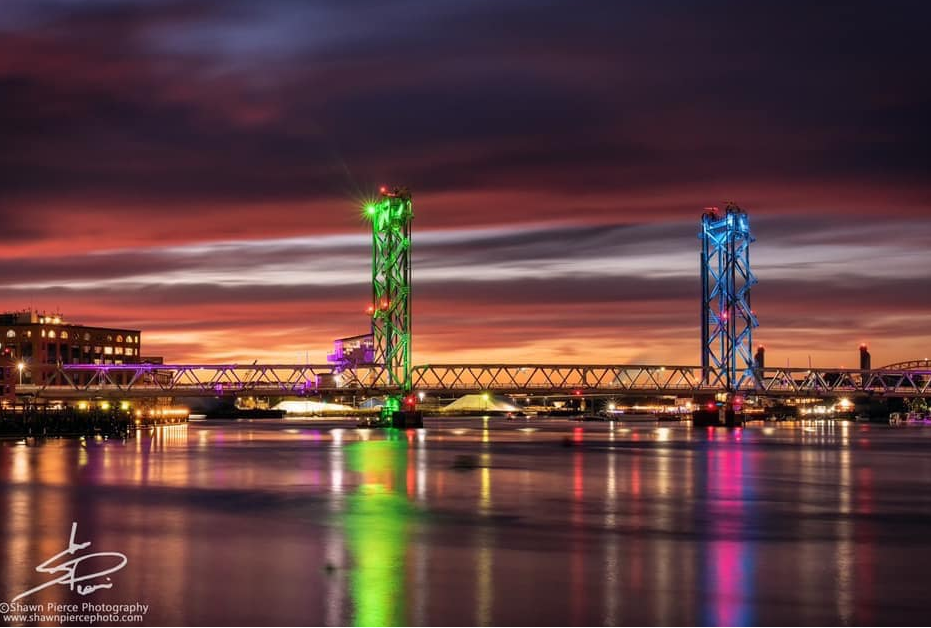 Memorial Bridge in Portsmouth lit up in the MBC awareness colors of teal, green and pink, as part of the #LightUpMBC campaign.