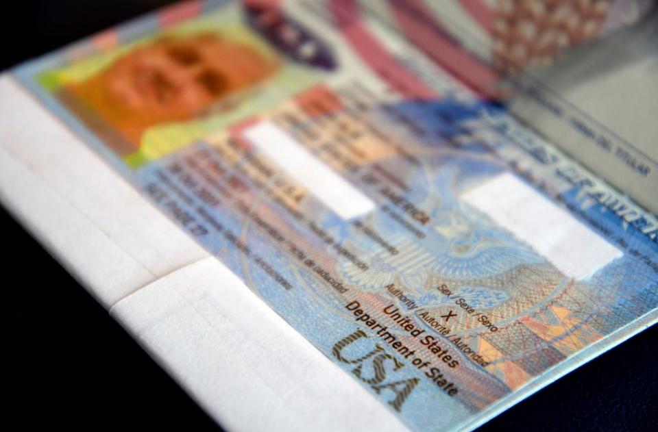 A passport belonging to Dana Zzyym rests on a table, Wednesday, Oct. 27, 2021, in Fort Collins, Colo. Zzyym, who prefers a gender-neutral pronoun, told the Associated Press that their passport is the first U.S. passport to be issued with an "X" gender designation, marking a milestone in the recognition of the rights of people who do not identify as male or female.