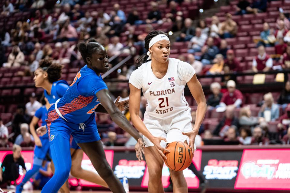 Florida State women's basketball player Makayla Timpson handles the ball against rival Florida.