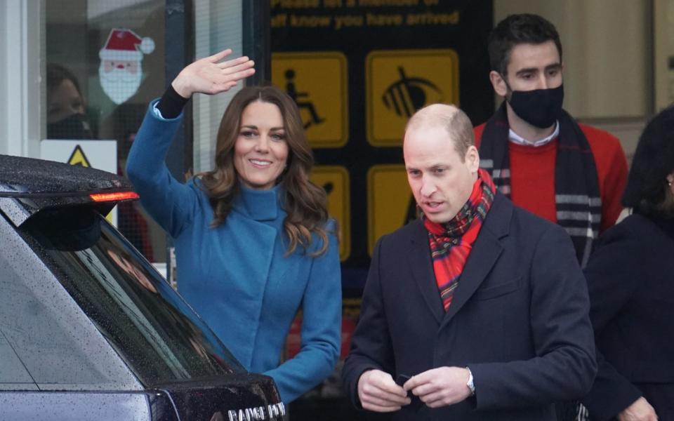 The Duke and Duchess of Cambridge with Christian Jones in the background, pictured in December 2020. - Owen Humphreys/PA