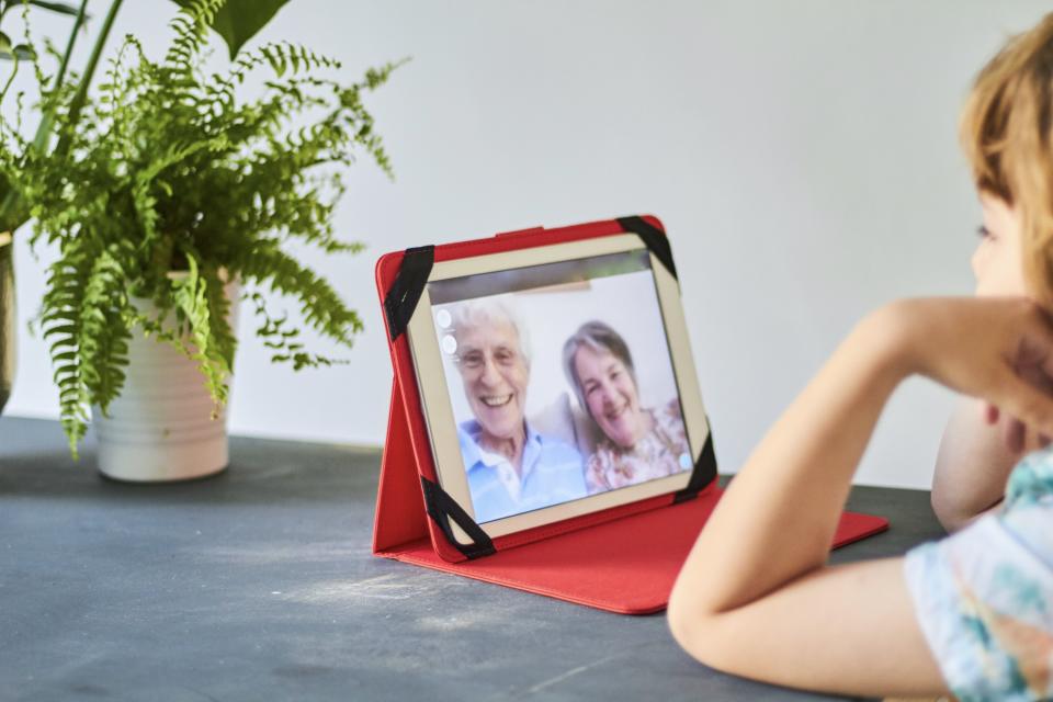 Boy talking with his grandparents using a portable digital device (Photo: Keep It 100 via Getty Images)