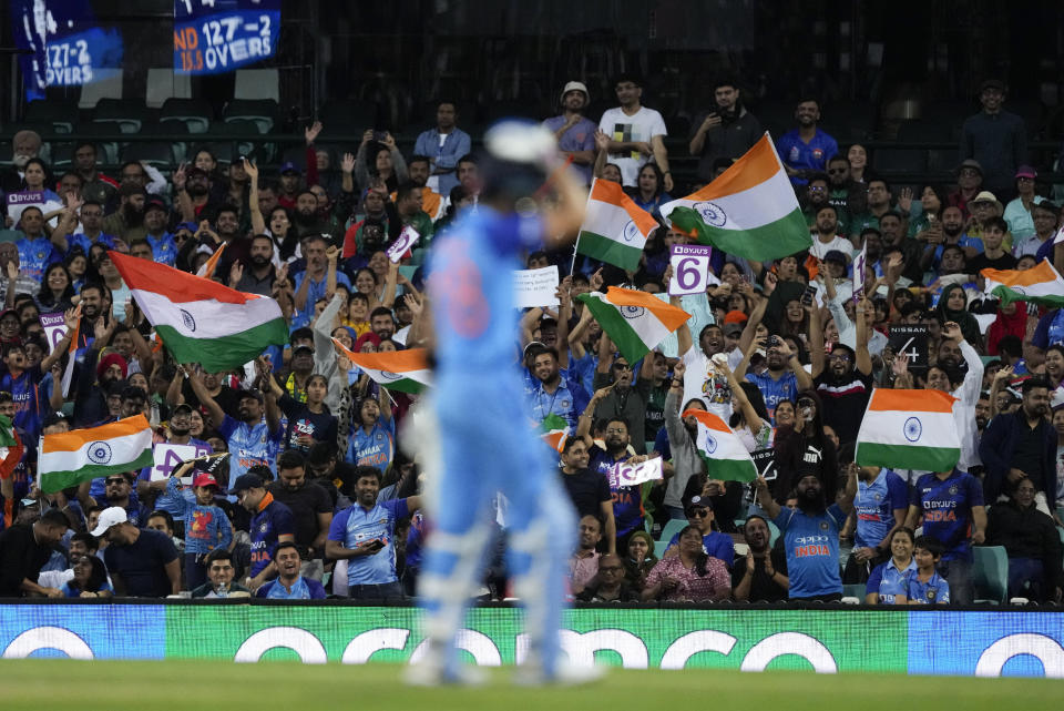 Indian fans cheer during the T20 World Cup cricket match between India and the Netherlands in Sydney, Australia, Thursday, Oct. 27, 2022. (AP Photo/Rick Rycroft)
