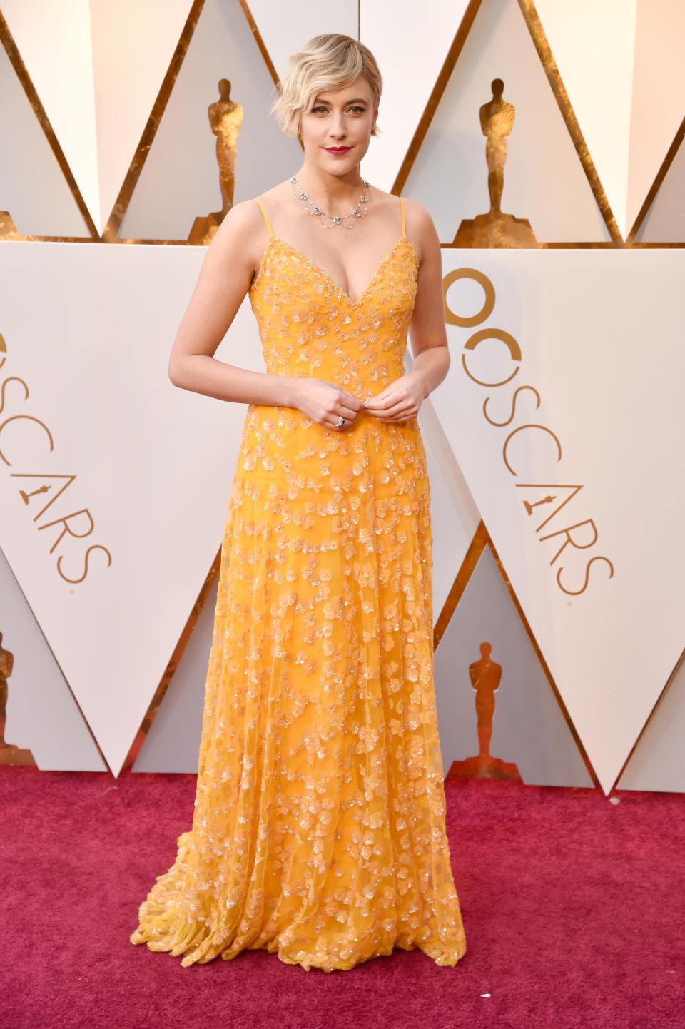 <p>Greta Gerwig wears a gorgeous hand-beaded gown designed by Rodarte.</p>