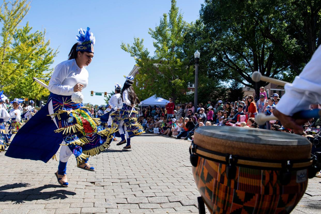 Participants in the Mexican delegation, who are members of St. Mary’s Catholic Church, wear traditional outfits and perform a dance to venerate the Virgin Mary, as part of the Parade of Cultures during the International Food and Art Festival on Saturday, October 1, 2022, in Jackson, Tenn. 