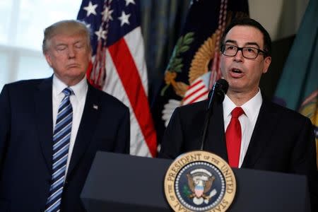 Treasury Secretary Steve Mnuchin speaks during a signing ceremony with President Donald Trump at the Treasury Department in Washington, U.S., April 21, 2017. REUTERS/Aaron P. Bernstein