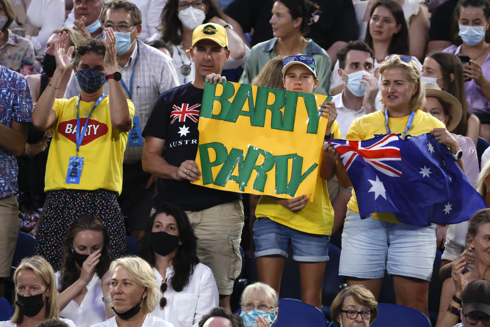 Supporters of Australia's Ash Barty hold up signs of support during her semifinal against Madison Keys of the U.S. at the Australian Open tennis championships in Melbourne, Australia, Thursday, Jan. 27, 2022. (AP Photo/Hamish Blair)