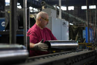 A steel worker manufactures 155 mm M795 artillery projectiles at the Scranton Army Ammunition Plant, Tuesday, Aug. 27, 2024, in Scranton, Pa. (AP Photo/Matt Slocum)