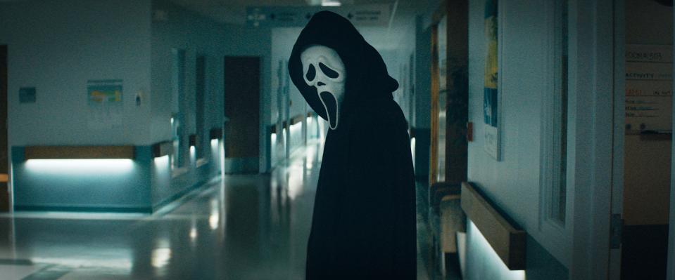 Ghostface stands in the hospital hallway