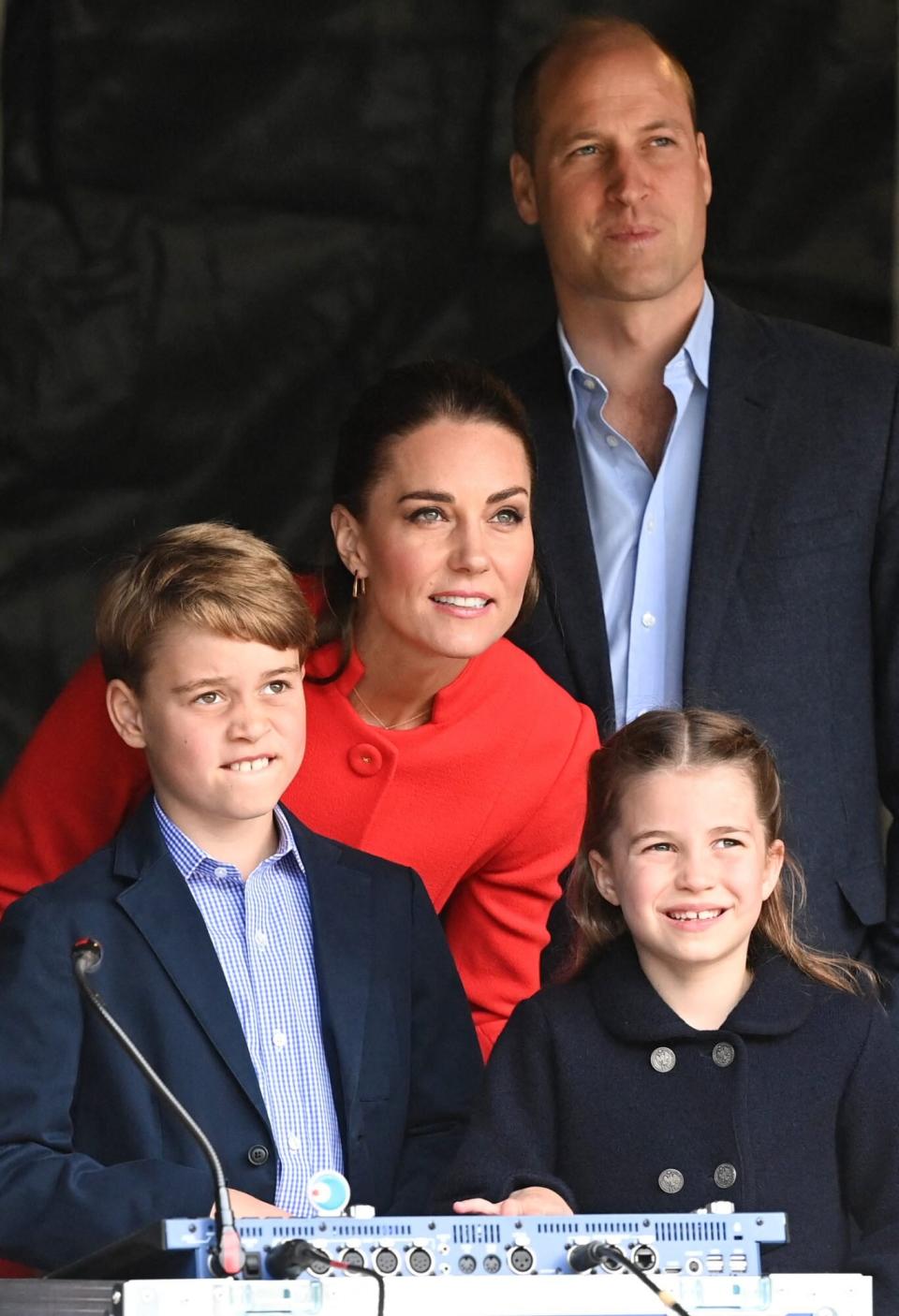 Prince William, Duke of Cambridge, Britain's Catherine, Duchess of Cambridge, and their children Britain's Prince George and Britain's Princess Charlotte check a concert's music setup backstage