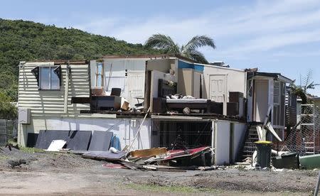 A home damaged by Cyclone Marcia is pictured without a roof and with some walls gone in the coastal town of Yeppoon, February 21, 2015. REUTERS/Jason Reed