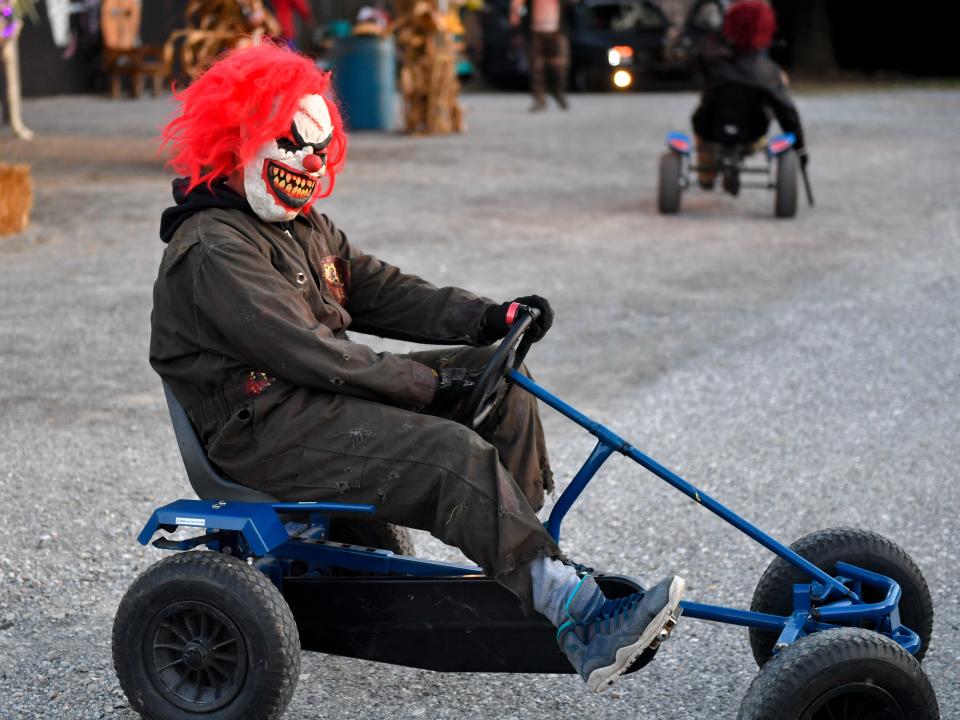 Actors ride around on tricycles creeping out anyone that sees them at Kim's Krypt Haunted Mill, October 12, 2018. 