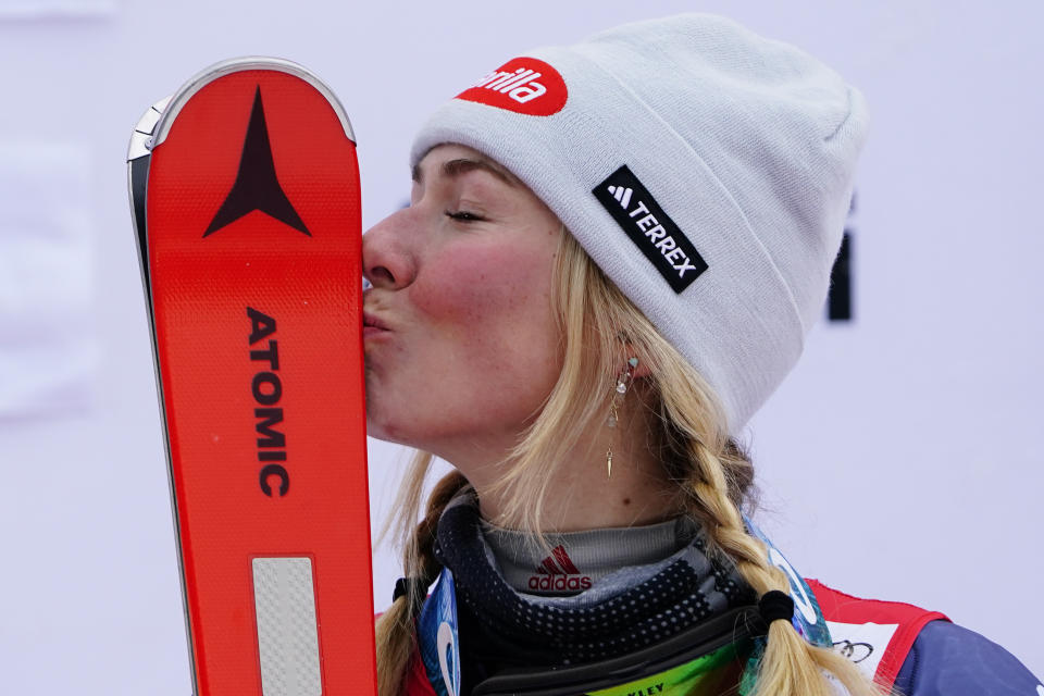 United States' Mikaela Shiffrin kisses her skis after winning an alpine ski, women's World Cup slalom, in Spindleruv Mlyn, Czech Republic, Saturday, Jan. 28, 2023. (AP Photo/Piermarco Tacca)