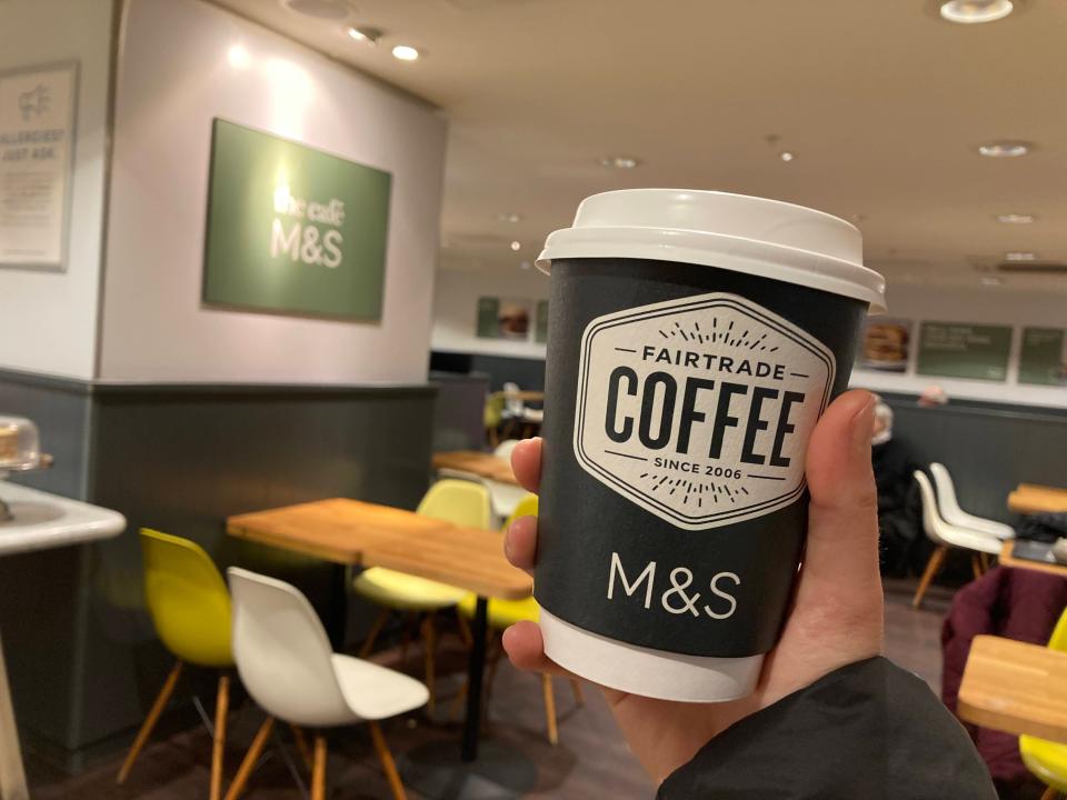 A latte from Marks and Spencer in a paper cup.