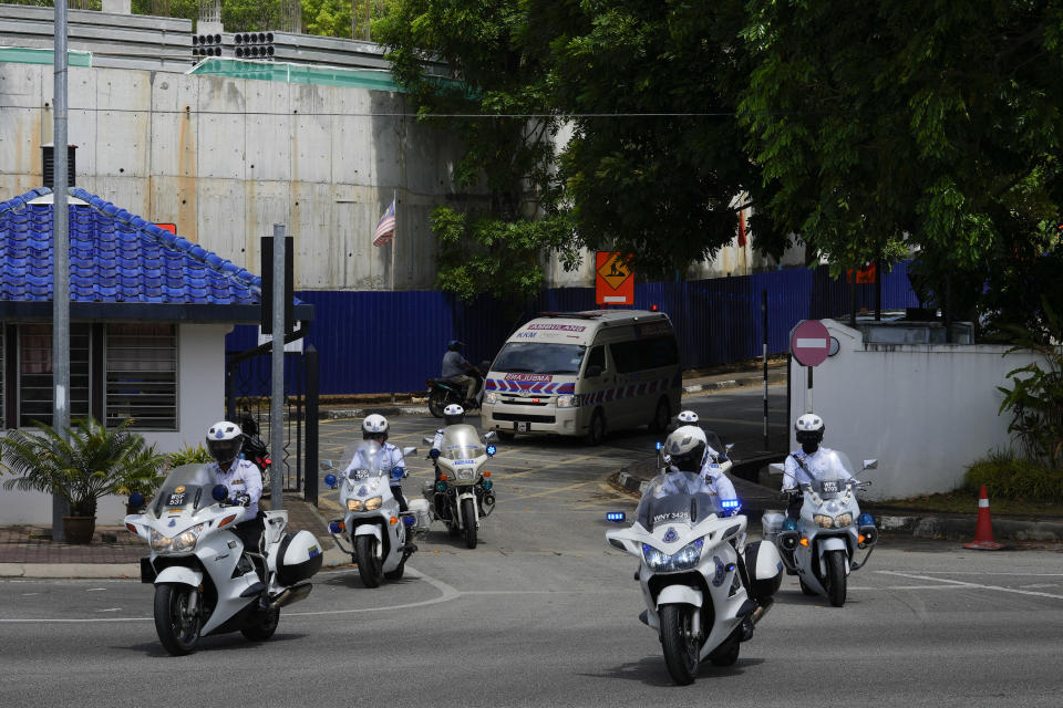 Motorcade believed to be carrying Norway's King Harald leave Sultanah Maliha Hospital, where the King has been admitted with an infection, on the Malaysian resort island of Langkawi, Malaysia, Sunday, March 3, 2024. (AP Photo/Vincent Thian)