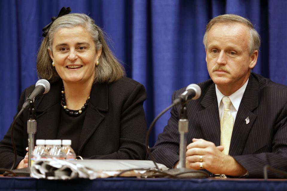 Kathryn Condon, Executive Director, Army National Military Cemeteries, left, and Patrick Hallihan, superintendent, Arlington National Cemetery, discuss the ANC Explorer application during a news conference in Washington, Monday, Oct. 22, 2012. Arlington National Cemetery plans to make available to the public the detailed geospatial database it has developed over several years while overhauling its records and responding to reports of misidentified remains. The database will be available over the Internet and through a mobile phone app that visitors to the cemetery can take with them to find a specific gave anywhere in the cemetery. (AP Photo/Jacquelyn Martin)