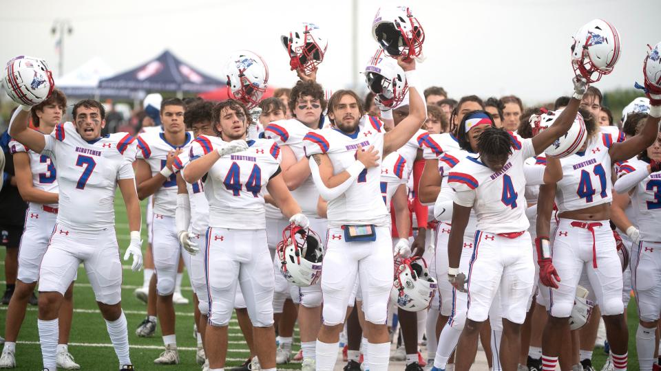 Members of the Washington Township High School football team stand during the playing of the national anthem prior to the Battle at the Beach football game between Washington Township and Mainland played in Ocean City, NJ, on Friday, August 25, 2023.