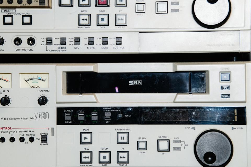 A detail photo of an old VHS deck.