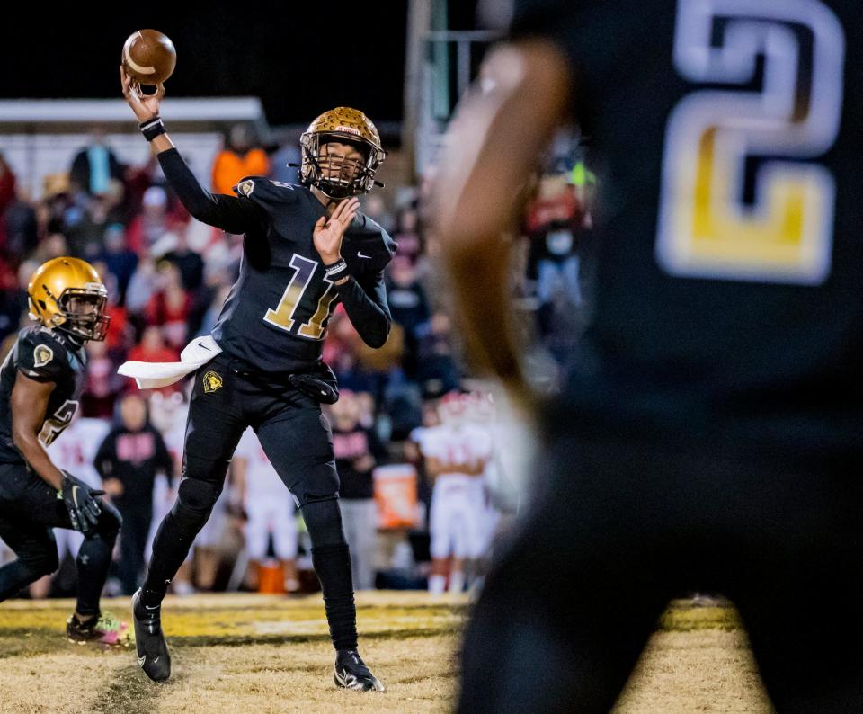 Shelby junior quarterback Daylin Lee throws against East Surry in the West 2A Final Friday night at Shelby High School. Shelby defeated East Surry 45-13 to advance.