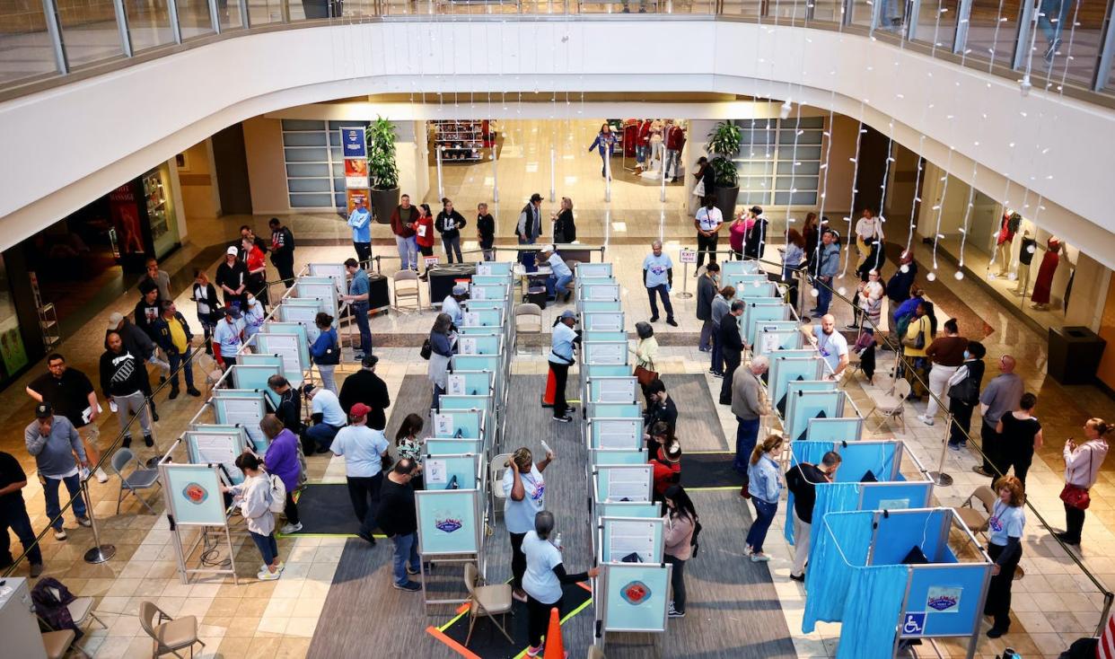 Despite intimidation both current and historical, American voters turned out in near-record numbers on Nov. 8, 2022. <a href="https://www.gettyimages.com/detail/news-photo/people-vote-as-poll-workers-assist-at-a-polling-place-at-news-photo/1440122451" rel="nofollow noopener" target="_blank" data-ylk="slk:Mario Tama/Getty Images;elm:context_link;itc:0;sec:content-canvas" class="link ">Mario Tama/Getty Images</a>