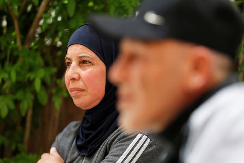 The mother of Hamza al-Masri, a Palestinian prisoner held in an Israeli jail, are seen during an interview with Reuters, in Bethlehem in the Israeli-occupied West Bank