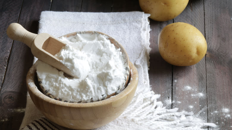 A wooden bowl of white potato starch