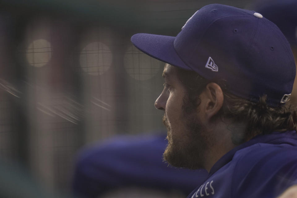 Los Angeles Dodgers starting pitcher Trevor Bauer looks on from the dugout during the fourth inning of a baseball game against the Washington Nationals, Thursday, July 1, 2021, in Washington. (AP Photo/Julio Cortez)