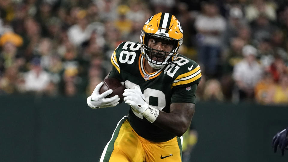 Green Bay Packers running back AJ Dillon (28) carries the ball up field during the second half of an NFL football game against the Chicago Bears Sunday, Sept. 18, 2022, in Green Bay, Wis. (AP Photo/Morry Gash)