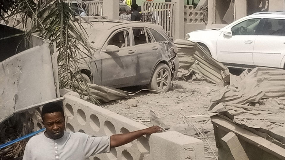 A man stands at the site of an explosion in Ibadan, Nigeria, Wednesday, Jan. 17, 2024. Several people died and many others were injured after a massive blast caused by explosives rocked more than 20 buildings in one of Nigeria's largest cities Tuesday night, authorities said Wednesday, as rescue workers dug through the rubble in search of those feared trapped. (AP Photo)