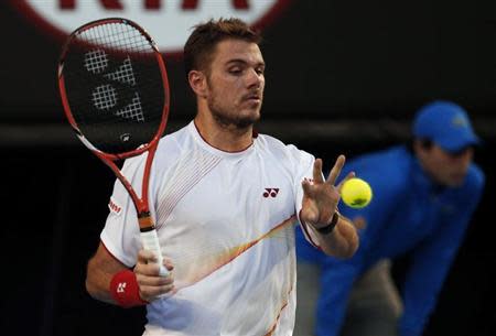 Stanislas Wawrinka of Switzerland catches a ball that was out during his men's singles final match against Rafael Nadal of Spain at the Australian Open 2014 tennis tournament in Melbourne January 26, 2014. REUTERS/Bobby Yip