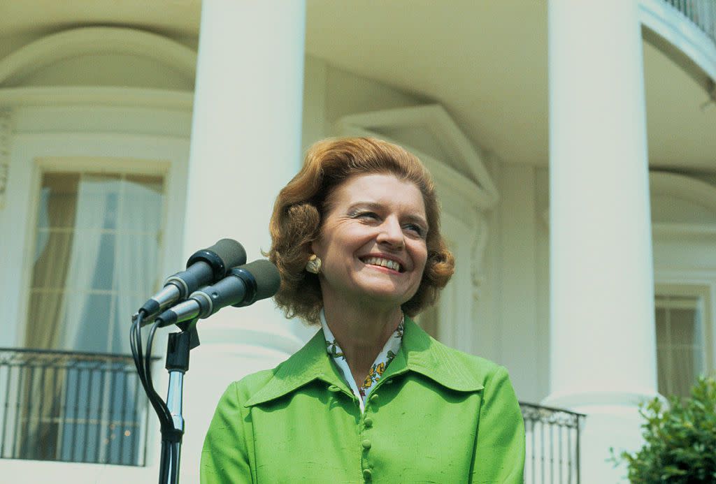 Washington, DC. Close-ups of Betty Ford smiling near microphone outside the White House.