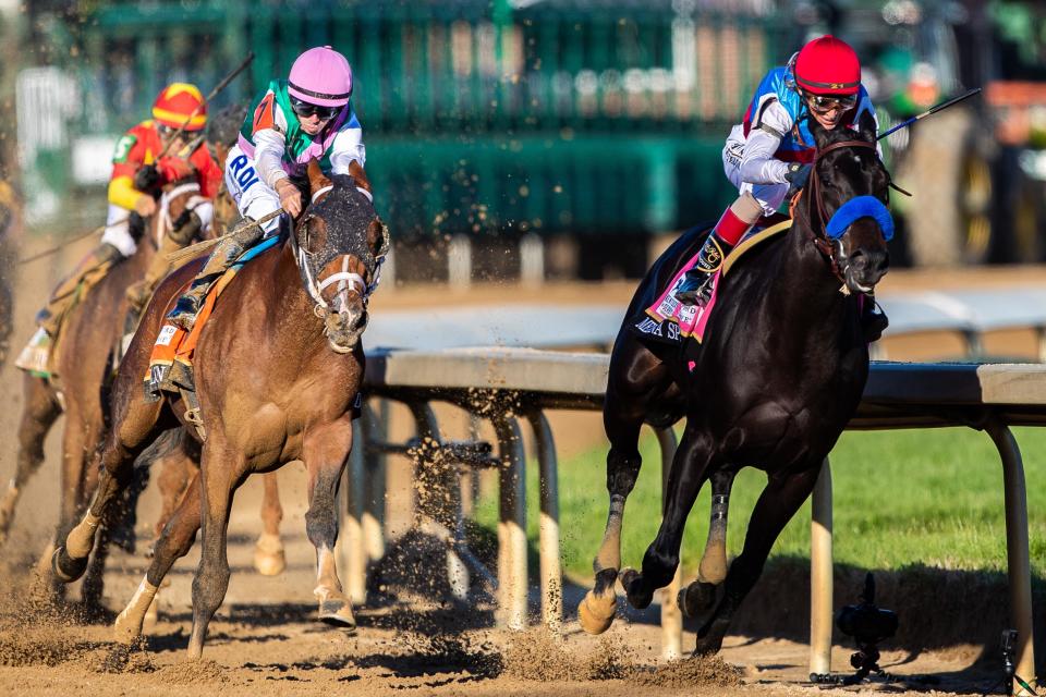 Florent Geroux aboard Mandaloun on the outside during the 147th running of the Kentucky Derby at Churchill Downs in 2021.