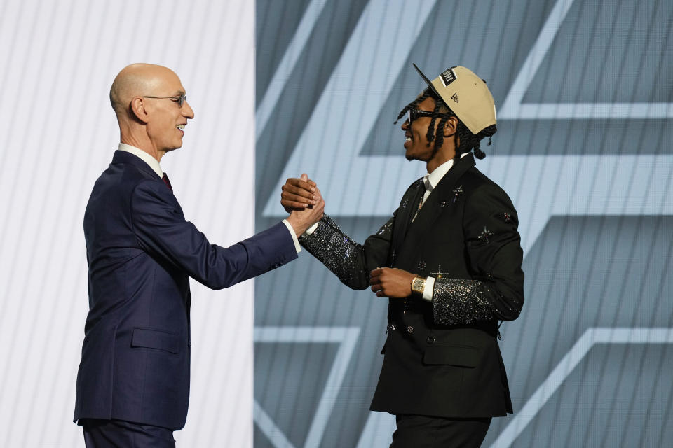 Rob Dillingham, right, greets NBA commissioner Adam Silver after being selected by the San Antonio Spurs during the first round of the NBA basketball draft, Wednesday, June 26, 2024, in New York. (AP Photo/Julia Nikhinson)
