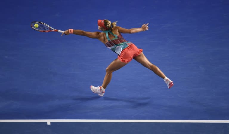 Germany's Angelique Kerber plays a backhand return during her women's singles final match against Serena Williams of the US at the 2016 Australian Open tennis tournament in Melbourne