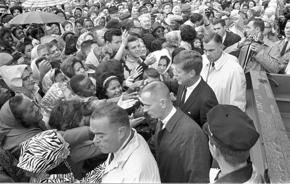 John F. Kennedy shaking hands with crowds outside Hotel Texas, Fort Worth. 11/22/1963