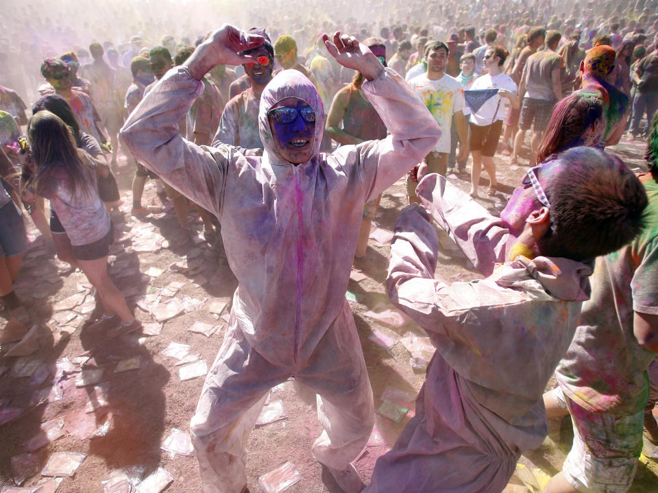 Participants dance and throw colored chalk during the Holi Festival of Colors at the Sri Sri Radha Krishna Temple in Spanish Fork, Utah, March 30, 2013.&nbsp;