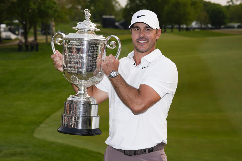 Brooks Koepka holds the Wanamaker trophy after winning the PGA Championship golf tournament at Oak Hill Country Club on Sunday, May 21, 2023, in Pittsford, N.Y. (AP Photo/Seth Wenig)